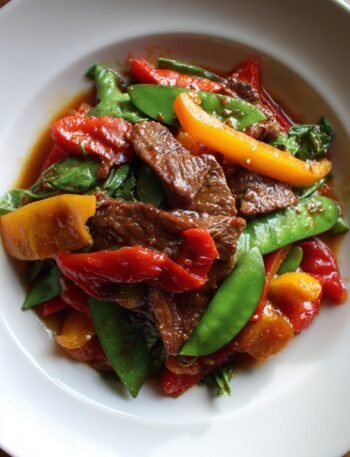 Beef and bell pepper stir-fry with snow peas.