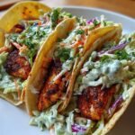 Blackened cod tacos with cabbage slaw and avocado