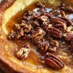 Brown butter pecan Dutch baby pancake with bourbon maple