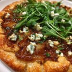 Caramelized onion and feta galette with arugula salad