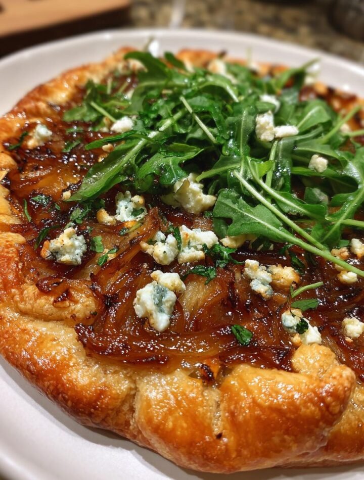 Caramelized onion and feta galette with arugula salad