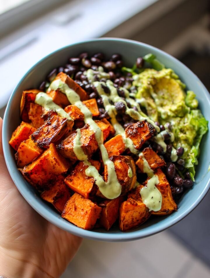 Smoked paprika sweet potato bowls with black beans and avocado crema